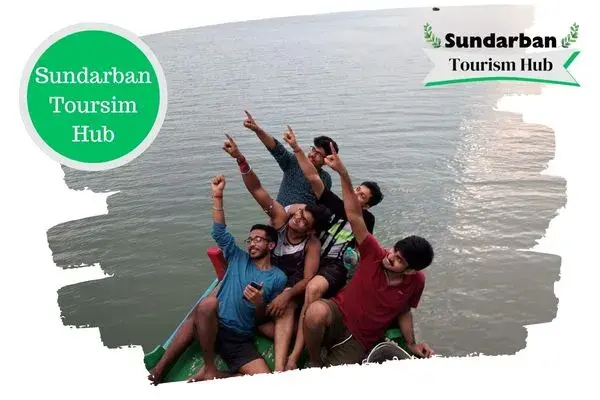 Young people enjoying boat safari in Sundarbans
